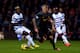 LONDON, ENGLAND - DECEMBER 30: Martin Skrtel of Liverpool controls the ball as Djibril Cisse of QPR closes in during the Barclays Premier League match between Queens Park Rangers and Liverpool at Loftus Road on December 30, 2012 in London, England. (Photo by Paul Gilham/Getty Images)