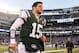 Dec. 23, 2012; East Rutherford, NJ, USA; New York Jets quarterback Tim Tebow (15) runs off the field after the game against the San Diego Chargers at MetLife Stadium. Chargers won 27-17. Mandatory Credit: Debby Wong-USA TODAY Sports