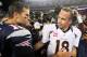 Oct 7, 2012; Foxborough, MA, USA; New England Patriots quarterback Tom Brady (12) shakes hands with Denver Broncos quarterback Peyton Manning (18) following the game at Gillette Stadium. The Patriots defeated the Broncos 31-21. Mandatory Credit: Stew Milne-USA TODAY Sports