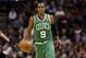 Dec 15, 2012; San Antonio, TX, USA; Boston Celtics guard Rajon Rondo (9) brings the ball up court during the second half against the San Antonio Spurs at the AT&T Center. The Spurs won 103-88. Mandatory Credit: Soobum Im-USA TODAY Sports