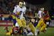 LOS ANGELES, CA - NOVEMBER 24: Theo Riddick #6 of the Notre Dame Fighting Irish rushes past Dion Bailey #18 of the USC Trojans during a 22-13 win at Los Angeles Memorial Coliseum on November 24, 2012 in Los Angeles, California. (Photo by Harry How/Getty Images)