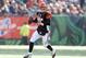 CINCINNATI, OH - DECEMBER 30: Andy Dalton #14 of the Cincinnati Bengals runs with the ball during the NFL game against the Baltimore Ravens at Paul Brown Stadium on December 30, 2012 in Cincinnati, Ohio. (Photo by Andy Lyons/Getty Images)