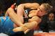 August 18, 2012; San Diego, CA, USA; Sarah Kaufman (blue shirt) and Ronda Rousey (black shirt) during their Strikeforce MMA women's bantamweight title bout at the Valley View Casino Center. Rousey won in 54 seconds of the first round. Mandatory Credit: Jayne Kamin-Oncea-USA TODAY Sports