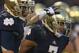 SOUTH BEND, IN - NOVEMBER 03: T.J. Jones #7 of the Notre Dame Fighting Irish gets a pat on the head from Robby Toma #9 after scoring a touchdown against the Pittsburgh Panthers at Notre Dame Stadium on November 3, 2012 in South Bend, Indiana. Notre Dame defeated Pittsburgh 29-26 in triple overtime. (Photo by Jonathan Daniel/Getty Images)