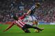 SUNDERLAND, ENGLAND - NOVEMBER 24: Danny Rose of Sunderland tackles Billy Jones of West Brom during the Barclays Premier League match between Sunderland and West Bromwich Albion at the Stadium of Light on November 24, 2012 in Sunderland, England. (Photo by Michael Regan/Getty Images)