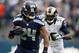 SEATTLE, WA - DECEMBER 30: Marshawn Lynch #24 (L) of the Seattle Seahawks runs from the St. Louis Rams defense in the first half at CenturyLink Field on December 30, 2012 in Seattle, Washington. (Photo by Kevin Casey/Getty Images)