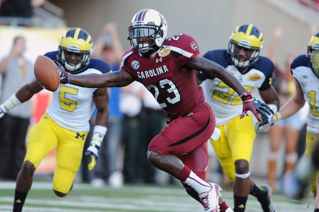 Old Rivals Ellington and Washington of Michigan Feel Outback Bowl Joy, Agony