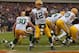 CHICAGO, IL - DECEMBER 16: Aaron Rodgers #12 of the Green Bay Packers passes out of his own end zone against the Chicago Bears at Soldier Field on December 16, 2012 in Chicago, Illinois. The Packers defeated the Bears 21-13. (Photo by Jonathan Daniel/Getty Images)