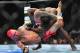 Dec 29, 2012; Las Vegas, NV, USA; Chris Leban (bottom) attempts a triangle choke on Derek Brunson (top) during UFC 155 at the MGM Grand Garden Arena. Mandatory Credit: Gary A. Vasquez-USA TODAY Sports