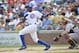 CHICAGO, IL - AUGUST 31: Alfonso Soriano #12 of the Chicago Cubs follows through on an RBI single scoring teammate Joe Mather #21 during the first inning at Wrigley Field on August 31, 2012 in Chicago, Illinois. (Photo by Brian Kersey/Getty Images)