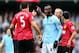 MANCHESTER, ENGLAND - DECEMBER 09: Rio Ferdinand of Manchester United and Mario Balotelli of Manchester City have words during the Barclays Premier League match between Manchester City and Manchester United at the Etihad Stadium on December 9, 2012 in Manchester, England. (Photo by Clive Mason/Getty Images)