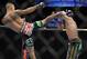 May 15, 2012; Fairfax, VA, USA; Donald Cerrone (left) lands a high kick to the blocking arms of Jeremy Stephens (right) during the Korean zombie vs Poirier event at Patriot Center. Mandatory Credit: Rafael Suanes-USA TODAY Sports