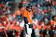 DENVER, CO - DECEMBER 30: Quarterback Peyton Manning #18 of the Denver Broncos looks toward the sideline as he warms up before a game against the Kansas City Chiefs at Sports Authority Field at Mile High on December 30, 2012 in Denver, Colorado. The Broncos defeated the Chiefs 38-3. (Photo by Dustin Bradford/Getty Images)