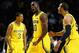 NEW YORK, NY - DECEMBER 15: Tim Hardaway Jr. #10 of the Michigan Wolverines reacts with teammates Trey Burke #3 and Jordan Morgan #52 after hitting a basket against West Virginia Mountaineers during the Brooklyn Hoops Winter Festival on December 15, 2012 at Barclays Center in the Brooklyn borough of New York City. (Photo by Mike Stobe/Getty Images)