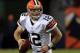 DENVER, CO - DECEMBER 23: Quarterback Colt McCoy #12 of the Cleveland Browns rolls out and looks for a receiver against the Denver Broncos at Sports Authority Field at Mile High on December 23, 2012 in Denver, Colorado. The Broncos defeated the Browns 34-12. (Photo by Doug Pensinger/Getty Images)