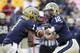 PITTSBURGH, PA - NOVEMBER 24: Tino Sunseri #12 of the Pittsburgh Panthers hands the ball off to Ray Graham #1 against the Rutgers Scarlet Knights during the game on November 24, 2012 at Heinz Field in Pittsburgh, Pennsylvania. The Panther defeated the Scarlet Knights 27-6. (Photo by Justin K. Aller/Getty Images)