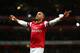 LONDON, ENGLAND - DECEMBER 29: Theo Walcott of Arsenal celebrates scoring their fourth goal during the Barclays Premier League match between Arsenal and Newcastle United at the Emirates Stadium on December 29, 2012 in London, England. (Photo by Clive Mason/Getty Images)