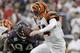 HOUSTON, TX - JANUARY 7: Quarterback Andy Dalton #14 of the Cincinnati Bengals rushes against the Houston Texans during their 2012 AFC Wild Card Playoff game at Reliant Stadium on January 7, 2012 in Houston, Texas. Texas won 31 to 10. (Photo by Thomas B. Shea/Getty Images)