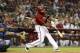 PHOENIX, AZ - SEPTEMBER 12: Justin Upton #10 of the Arizona Diamondbacks hits a RBI single against the Los Angeles Dodgers during the sixth inning of the MLB game at Chase Field on September 12, 2012 in Phoenix, Arizona. (Photo by Christian Petersen/Getty Images)