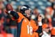 DENVER, CO - DECEMBER 30: Quarterback Peyton Manning #18 of the Denver Broncos warms up before a game against the Kansas City Chiefs at Sports Authority Field Field at Mile High on December 30, 2012 in Denver, Colorado. (Photo by Dustin Bradford/Getty Images)
