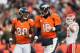 DENVER, CO - DECEMBER 30: Quarterback Peyton Manning #18 and wide receiver Demaryius Thomas #88 of the Denver Broncos run off the field after a score during a game against the Kansas City Chiefs at Sports Authority Field at Mile High on December 30, 2012 in Denver, Colorado. The Broncos defeated the Chiefs 38-3. (Photo by Dustin Bradford/Getty Images)