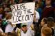 BOSTON, MA - NOVEMBER 14: A fan holds up a 'Please end the lockout' sign while wearing a Boston Bruins jersey during the game between the Boston Celtics and the Utah Jazz on November 14, 2012 at TD Garden in Boston, Massachusetts. NOTE TO USER: User expressly acknowledges and agrees that, by downloading and or using this photograph, User is consenting to the terms and conditions of the Getty Images License Agreement. (Photo by Jared Wickerham/Getty Images)