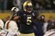 CHICAGO, IL - OCTOBER 06: Manti Te'o #5 of the Notre Dame Fighting Irish calls defensive signals against the Miami Hurricanes at Soldier Field on October 6, 2012 in Chicago, Illinois. Notre Dame defeated Miami 41-3. (Photo by Jonathan Daniel/Getty Images)