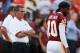 LANDOVER, MD - AUGUST 29: Robert Griffin III #10 of the Washington Redskins walks past head coach Mike Shanahan before the start of the Redskins game against the Tampa Bay Buccaneers at FedExField on August 29, 2012 in Landover, Maryland. (Photo by Rob Carr/Getty Images)