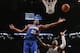 NEW YORK, NY - DECEMBER 23: Thaddeus Young #21 of the Philadelphia 76ers grabs the rebound against the Brooklyn Nets at Barclays Center on December 23, 2012 in the Brooklyn borough of New York City. NOTE TO USER: User expressly acknowledges and agrees that, by downloading and/or using this photograph, user is consenting to the terms and conditions of the Getty Images License Agreement. (Photo by Bruce Bennett/Getty Images)