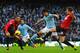 MANCHESTER, ENGLAND - DECEMBER 09: Sergio Aguero of Manchester City is challenged by Michael Carrick of Manchester United during the Barclays Premier League match between Manchester City and Manchester United at the Etihad Stadium on December 9, 2012 in Manchester, England. (Photo by Laurence Griffiths/Getty Images)
