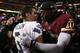 LANDOVER, MD - JANUARY 06: Robert Griffin III #10 of the Washington Redskins embraces Russell Wilson #3 of the Seattle Seahawks after the Seahawks defeated the Redskins 24 to 14 during the NFC Wild Card Playoff Game at FedExField on January 6, 2013 in Landover, Maryland. (Photo by Win McNamee/Getty Images)