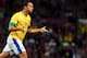 MANCHESTER, ENGLAND - AUGUST 07: Leandro Damiao of Brazil reacts after scoring during the Men's Football Semi Final match between Korea and Brazil, on Day 11 of the London 2012 Olympic Games at Old Trafford on August 7, 2012 in Manchester, England. (Photo by Stanley Chou/Getty Images)