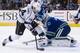 VANCOUVER, CANADA - JANUARY 17: Goalie Roberto Luongo #1 of the Vancouver Canucks stops Justin Williams #14 of the Los Angeles Kings in close during the third period in NHL action on January 17, 2012 at Rogers Arena in Vancouver, British Columbia, Canada. (Photo by Rich Lam/Getty Images)