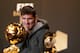 ZURICH, SWITZERLAND - JANUARY 07: Lionel Messi of Barcelona watches Ballon d'Or trophy during the Press Conference with nominees for World Player of the Year and World Coach of the Year for Men's Football on January 7, 2013 at Congress House in Zurich, Switzerland. (Photo by Christof Koepsel/Getty Images)