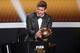 ZURICH, SWITZERLAND - JANUARY 07: Lionel Messi of Argentina receives the FIFA Ballon d'Or 2012 trophy on January 7, 2013 in Zurich, Switzerland. (Photo by Christof Koepsel/Getty Images)