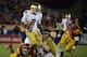LOS ANGELES, CA - NOVEMBER 24: Theo Riddick #6 of the Notre Dame Fighting Irish rushes past Dion Bailey #18 of the USC Trojans during a 22-13 win at Los Angeles Memorial Coliseum on November 24, 2012 in Los Angeles, California. (Photo by Harry How/Getty Images)