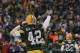 GREEN BAY, WI - JANUARY 01: Morgan Burnett #42 and Charlie Peprah #26 of the Green Bay Packers celebrate a win over the Detroit Lions at Lambeau Field on January 1, 2012 in Green Bay, Wisconsin. The Packers defeated the Lions 45-41. (Photo by Jonathan Daniel/Getty Images)