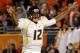 MIAMI GARDENS, FL - JANUARY 04: Geno Smith #12 of the West Virginia Mountaineers reacts against the Clemson Tigers during the Discover Orange Bowl at Sun Life Stadium on January 4, 2012 in Miami Gardens, Florida. (Photo by Streeter Lecka/Getty Images)