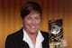 ZURICH, SWITZERLAND - JANUARY 07: Abby Wambach of United States receives her FIFA womens player of the year trophy during the FIFA Ballon d'Or Gala 2013 at Congress House on January 07, 2013 in Zurich, Switzerland. (Photo by Christof Koepsel/Getty Images)