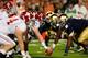 MIAMI GARDENS, FL - JANUARY 07: AJ McCarron #10 of the Alabama Crimson Tide lines up under his center Barrett Jones #75 against the Notre Dame Fighting Irish during the 2013 Discover BCS National Championship game at Sun Life Stadium on January 7, 2013 in Miami Gardens, Florida. (Photo by Kevin C. Cox/Getty Images)