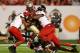 MIAMI GARDENS, FL - JANUARY 01: James Wilder Jr. #32 of the Florida State Seminoles runs the ball against Donovan Gordon #94 of the Northern Illinois Huskies during the Discover Orange Bowl at Sun Life Stadium on January 1, 2013 in Miami Gardens, Florida. (Photo by Streeter Lecka/Getty Images)