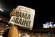 MIAMI GARDENS, FL - JANUARY 07: A member of the Alabama Crimson Tide holds up a newpaper front page with a headline reading 'Bama Again!' after they defeated the Notre Dame Fighting Irish by a score of 42-14 to win the 2013 Discover BCS National Championship game at Sun Life Stadium on January 7, 2013 in Miami Gardens, Florida. (Photo by Kevin C. Cox/Getty Images)