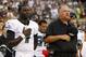 PHILADELPHIA, PA - AUGUST 09: Michael Vick #7 and head coach Andy Reid of the Philadelphia Eagles observe a moment of silence in memory of Reid's son Garrett before a preseason game against the Pittsburgh Steelers at Lincoln Financial Field on August 9, 2012 in Philadelphia, Pennsylvania. (Photo by Jeff Zelevansky/Getty Images)