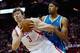 HOUSTON, TX - JANUARY 02: Omer Asik #3 of the Houston Rockets grabs a rebound in front of Anthony Davis #23 of the New Orleans Hornets at Toyota Center on January 2, 2013 in Houston, Texas. NOTE TO USER: User expressly acknowledges and agrees that, by downloading and or using this photograph, User is consenting to the terms and conditions of the Getty Images License Agreement. (Photo by Scott Halleran/Getty Images)