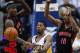 April 09, 2012; Indianapolis, IN, USA; Indiana Pacers shooting guard Paul George (24) passes the ball off as Toronto Raptors power forward Ed Davis (32) and shooting guard DeMar DeRozan (10) defend at Bankers Life Fieldhouse. Mandatory credit: Michael Hickey-USA TODAY Sports