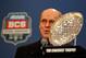 January 10, 2012; New Orleans, LA, USA; BCS executive director Bill Hancock with the coaches trophy during a press conference at the Marriott Convention Center Hotel presenting the championship trophies from the 2012 BCS National Championship game between the Alabama Crimson Tide and LSU Tigers. Mandatory Credit: Derick E. Hingle-USA TODAY Sports