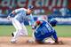 KANSAS CITY, MO - JULY 08: Scooter Gennett #11 of Team USA tags out Oscar Taveras #15 of the World Team as Taveras tries to steal second during the SiriusXM All-Star Futures Game at Kauffman Stadium on July 8, 2012 in Kansas City, Missouri. (Photo by Jamie Squire/Getty Images)