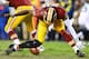 LANDOVER, MD - JANUARY 06: Robert Griffin III #10 of the Washington Redskins is injured as he fumbles a bad snap in the fourth quarter against the Seattle Seahawks during the NFC Wild Card Playoff Game at FedExField on January 6, 2013 in Landover, Maryland. (Photo by Al Bello/Getty Images)