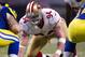 ST. LOUIS, MO - DECEMBER 02: Defensive end Justin Smith #94 of the San Francisco 49ers lines up prior to the play during the game against the St. Louis Rams at the Edward Jones Dome on December 2, 2012 in St. Louis, Missouri. (Photo by David Welker/Getty Images)