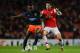 LONDON, ENGLAND - NOVEMBER 21: Mapou Yanga-mbiwa of Montpellier clashes with Mikel Arteta of Arsenal during the UEFA Champions League group B match between Arsenal FC and Montpellier Herault SC at Emirates Stadium on November 21, 2012 in London, England. (Photo by Mike Hewitt/Getty Images)